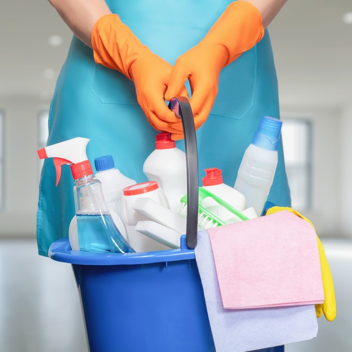 housekeepers holding cleaning bucket and supplies in Frisco TX